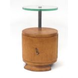 Art Deco circular oak pedestal occasional table with glass top and cupboard base, 68cm high x 40cm