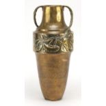 Large Art Nouveau brass vase with stylised twin handles, embossed with flowers, 42.5cm high