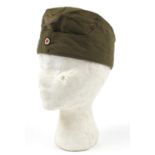 German military interest tropical side cap with badges, Hans Brandt stamp to the interior