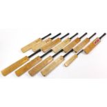 Twelve miniature 1960's cricket bats, eleven with ink signatures including West Indies, Hampshire,