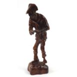 Continental wood carving of an elderly gentleman, labels to the base, 34.5cm high