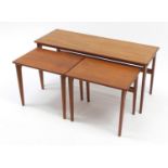 Kai Kristiansen, 1970's Danish nest of three teak occasional tables, stamped made in Denmark, the