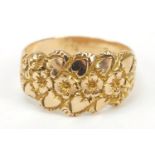 Unmarked gold flower head and love heart ring, size O, 4.2g