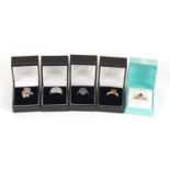 Five silver rings set with semi precious stones housed in gift boxes, various sizes, 22.5g