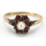 9ct gold pearl and garnet flower head ring, size Q, 2.0g