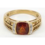 9ct gold red stone and diamond ring with orange stone shoulders, size O, 3.2g