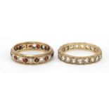Two 9ct gold eternity rings set with clear and red stones, sizes M and O, 3.6g