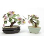 Two Chinese hardstone bonsai trees including one housed in a celadon planter, the largest 16cm wide
