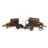 Two pairs of military interest binoculars with leather cases, comprising Buch Prisma-Binocle and