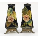 Pair of French floral encrusted pottery vases of triangular form with bronzed bases, each