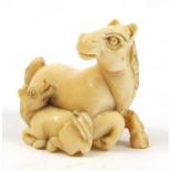 Japanese carved ivory Netsuke of two horses, 4cm high