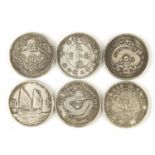 Six Chinese silver coloured metal coins