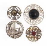 Four silver Scottish Celtic brooches, the largest 5cm in diameter, total 64.2g