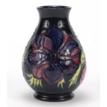 Moorcroft pottery baluster vase, hand painted with stylised flowers, 13.5cm high