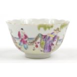 Chinese porcelain bowl finely hand painted in the famille rose palette with figures in a palace