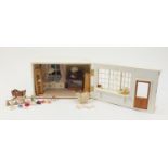 Hand built wooden doll's house shop with contents, 24cm H x 39cm W x 33cm D