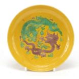 Chinese yellow ground green and aubergine porcelain dish hand painted with dragons chasing a flaming