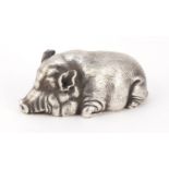 Russian silver model of a pig with pink glass eyes, impressed marks to the base, 9cm in length, 97.