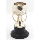 Arts & Crafts silver trophy with R.G. England inscription, raised on an ebonised stand, London 1869,