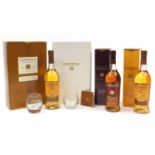 Three bottles of Glenmorangie whiskey with boxes including the original gift set with two crystal