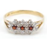 9ct gold garnet and cubic zirconia triple flower head ring, size P, 1.5g