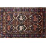 Rectangular Afghan Baluch rug decorated with a deer amongst flowers, 188cm x 123cm