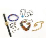 Costume jewellery including a natural amber necklace, Swatch watch and charms