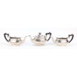 Pair of silver plated wall pockets in the form of half teapots and a similar silver plated teapot