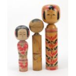 Three Japanese Kokeshi hand painted wood dolls, the largest 36.5cm high