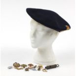 British militaria including a Civil Defence Corps beret, silver and enamel RAF brooch and cap badges