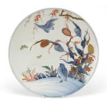 Japanese porcelain charger hand painted with birds and butterflies amongst flowers, painted marks to