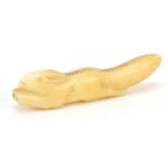 Inuit carved ivory amulet in the form of a squirrel, 6.5cm in length