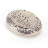 Oval sterling silver snuff box, the hinged lid embossed with soldiers, 6.5cm wide, 34.8g