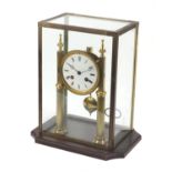 19th century brass two pillar mantle clock striking on a bell with enamel dial and Roman numerals,