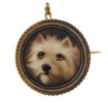 Victorian enamelled dog's head brooch with unmarked gold mount, inscribed J W Bailey 1883 to the