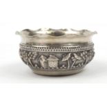 Burmese silver coloured metal bowl, embossed with figures in a landscape, 5cm high x 10.5cm in
