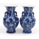 Large pair of Chinese blue and white porcelain vases with elephant head handles, each hand painted