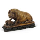Good Chinese russet soapstone carving of a pig and two piglets on naturalistic stand, 17.5cm wide