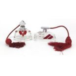 Two Art Deco red flashed cut glass atomisers with chrome mounts, the largest 13cm in length