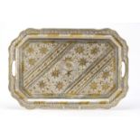 Omani silver coloured metal serving tray decorated and gilded with flowers, 51.5cm wide