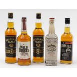 Five bottles of whiskey comprising two bottles of Highland Black, Wild Turkey, Jack Daniels Apple