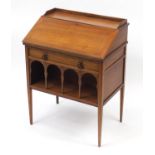 Liberty & Co, Arts & Crafts walnut student's bureau with a fall above a drawer and open shelf,