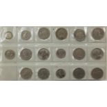 British coinage arranged in an album including pre 1947 florins, half crowns, fifty pence pieces and