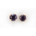 Pair of 9ct gold amethyst stud earrings, 3mm in diameter, 0.4g