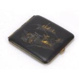 Japanese komai style damascene cigarette case decorated with a figure walking to pagodas, 9.5cm wide