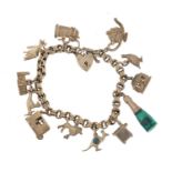 Silver charm bracelet with a selection of mostly silver charms including animals, church, beer stein