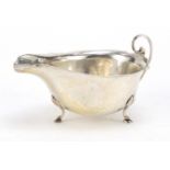 Asprey, George V silver sauce boat raised on three hoof feet, Birmingham 1924, 14cm in length, 87.2g