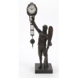 Military interest patinated bronze mystery clock in the form of a pilot, 33cm high
