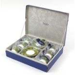 Set of six Aynsley onyx green coffee cans with saucers housed in a fitted box, 37cm wide