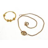 Unmarked gold hoop earring and a 9ct gold bracelet, 16cm in length, total 2.7g
